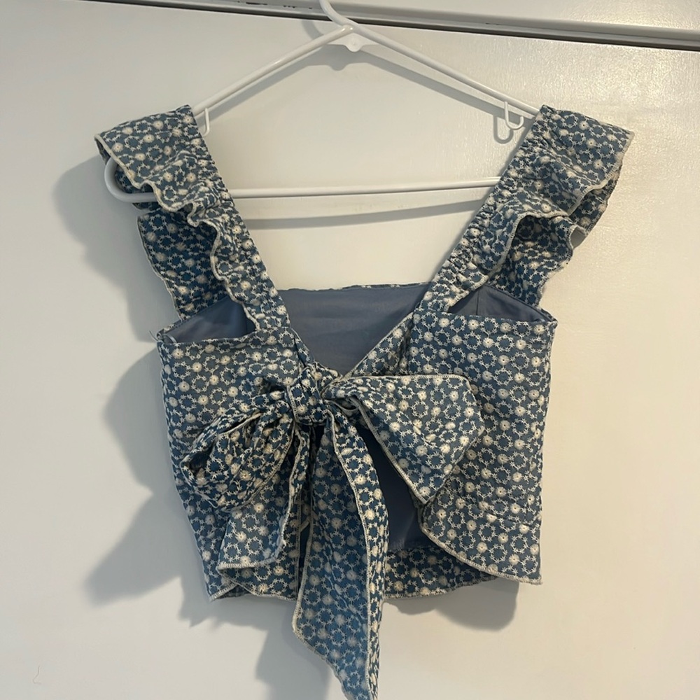Blue and white embroidered top with bow